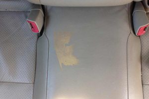 Gray leather middle backseat stained