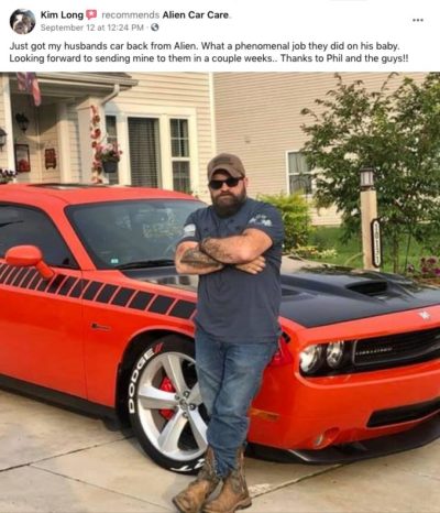 Aaron long posing with orange Challenger Facebook review